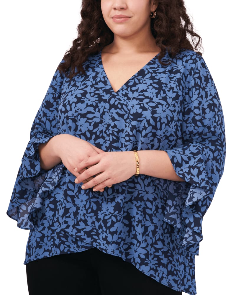 Front of a model wearing a size 1X Maya Flutter Sleeve Tunic in VINTAGE BLUE by Vince Camuto. | dia_product_style_image_id:261663